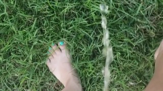 Girl Pees While Walking In Grass