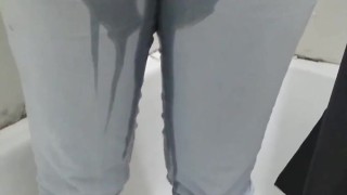 Busty girl pisses her pants