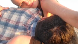 Adult nursing session on public beach at sunrise (short video)