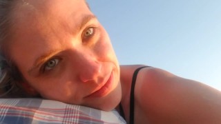 Adult nursing session on public beach at sunrise (short video)