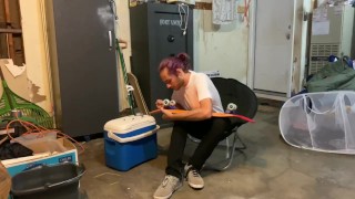 Putting riser pads on my roommates skateboard in my garage 