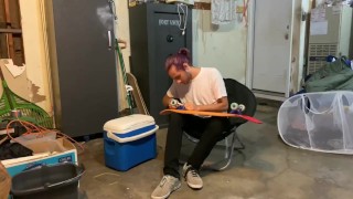 Putting riser pads on my roommates skateboard in my garage 