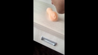 Twink licks own cum from fake pussy