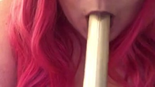 Pink haired girl gives dildo a blowjob 