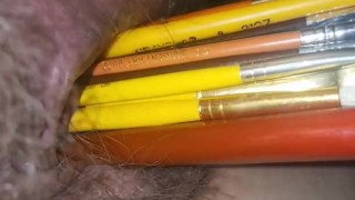 Pussy stuffed with paintbrushes