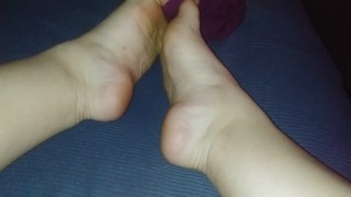 Pulling off purple socks with pink lights Rate my feet