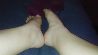 Pulling off purple socks with pink lights Rate my feet