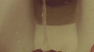 Close-up hairy pussy pissing on public toilet after holding 