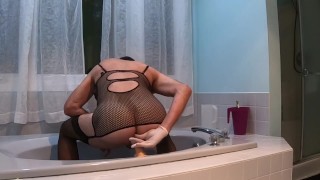 wearing her fishnets corset and fucking my ass with a dildo