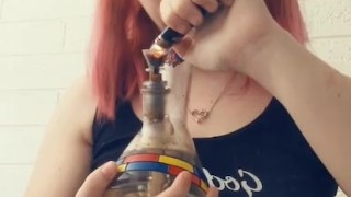 Cute teen takes a huge rip from her bong