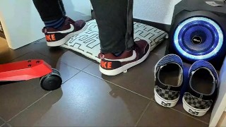 Male shoeplay and stomping stuff at home in Nikes, Vans, blue stiped socks
