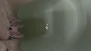 Milf pissing holding pussy 