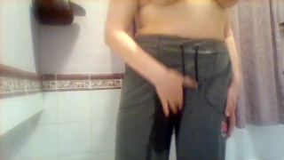 Wetting grey sweatpants and rubbing pussy