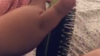 Horny slut spreads her legs to fuck her hairbrush