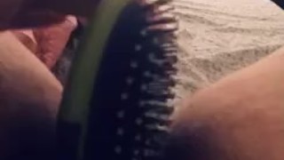Horny slut spreads her legs to fuck her hairbrush