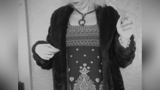Smoking in fur coat.