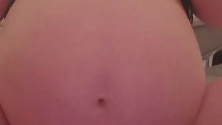 Hugely pregnant girl shows off her unborn