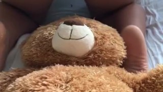 BABYSITTER PLAYS WITH TEDDYBEAR