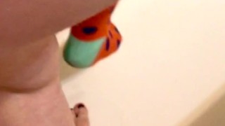Pissing on Colorful Socks (View from Behind)