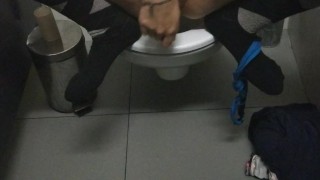 Public restroom masturbation with a carrot while people are around