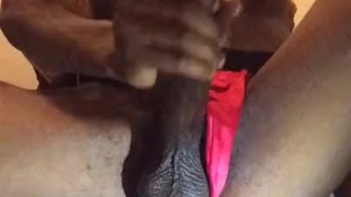 Stroking his dick in thong