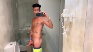 Quick hotel bathroom cumshot into sink in swim trunks while friend is gone