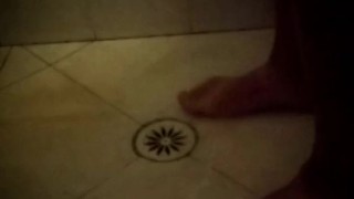Soapy shower feet and rubbing one down - peephole view