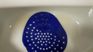 Public urinal piss