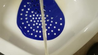 Public urinal piss
