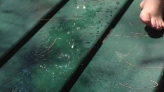 MILF pees on a picnic table at a public beach