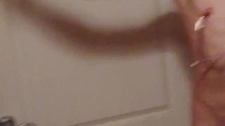 Slave performing jumping jacks with a belly full of water after enema