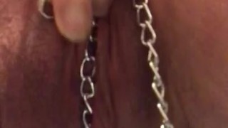 Quick pee in metal chains and nipple clamps