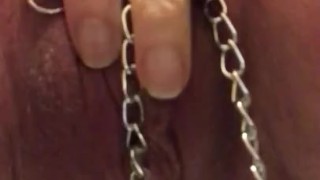Quick pee in metal chains and nipple clamps