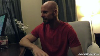 Black doctor removing something from the ass of a white guy