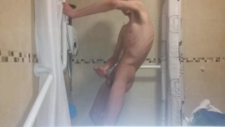 Very skinny teen strokes his very hard cock in bathroom 