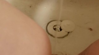 Horny teen masturbates with tub facet