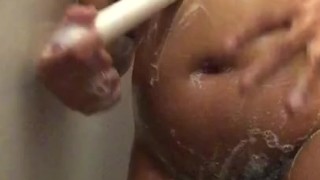 Lesbian masturbates in the shower 