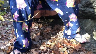 Wife pissing outside in the leaves