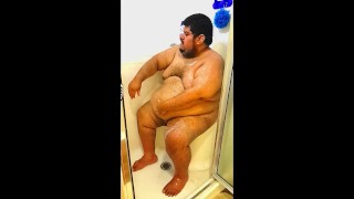 Superchub Squeezing himself in a tiny walk in shower with a built in seat
