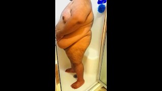 Superchub Squeezing himself in a tiny walk in shower with a built in seat
