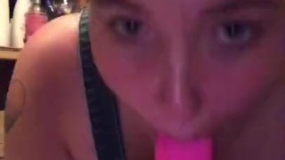 Emo whore gags on pink dildo and strips 