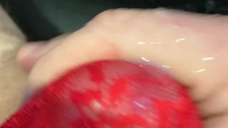 Big watery cum shot through red mesh thong whilst watching porn