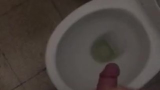 Jerking off in a public toilet. Almost caught by the cleaner!