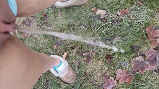 Girl Standing Pee Outside In Grass