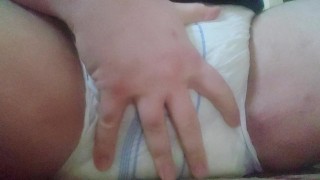 Chubby boy wets his diaper and spanks his padded crotch