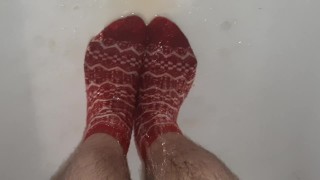 Wetting grey pants and red socks