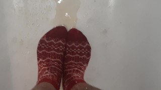 Wetting grey pants and red socks