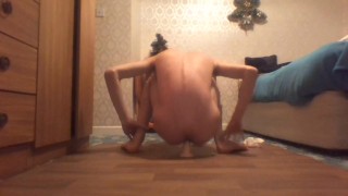 Skinny twig rides a dildo while in a long white shirt