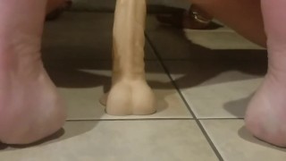 Riding a dildo