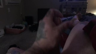 Tattooed guy stroking big cock till he cums